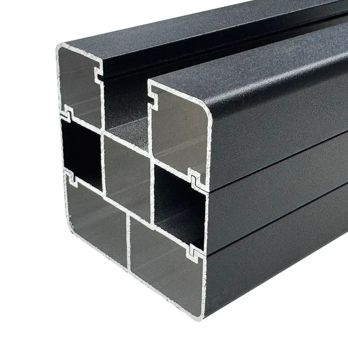 Close-up of black aluminum fence post showing internal multi-channel extrusion design for strength and secure fence panel installation
