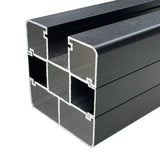 Close-up of black aluminum fence post showing internal multi-channel extrusion design for strength and secure fence panel installation