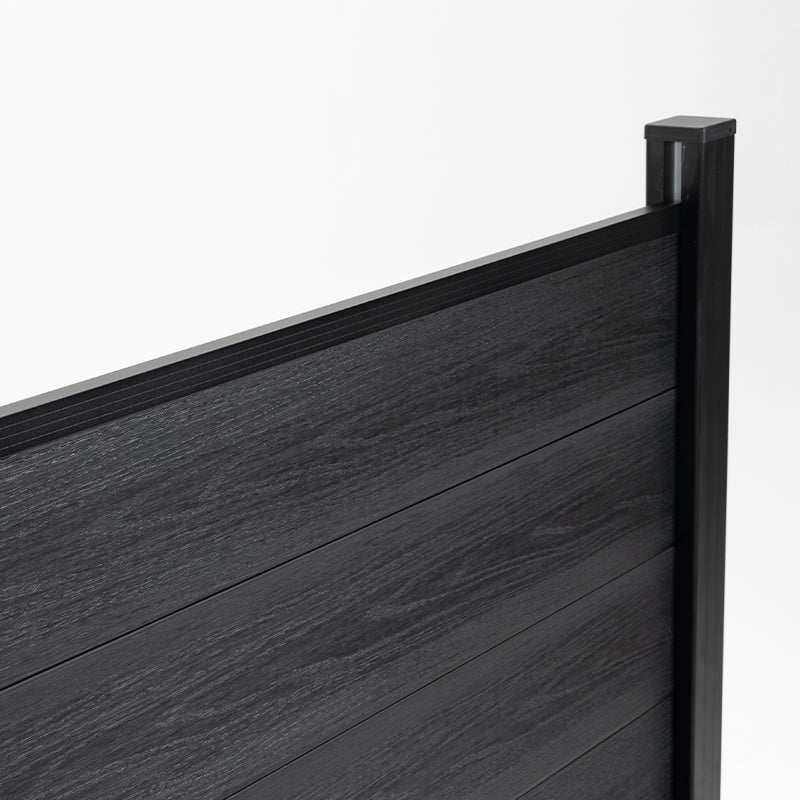 Black co-extruded composite fence panel close-up with woodgrain texture and aluminum post for outdoor privacy fencing