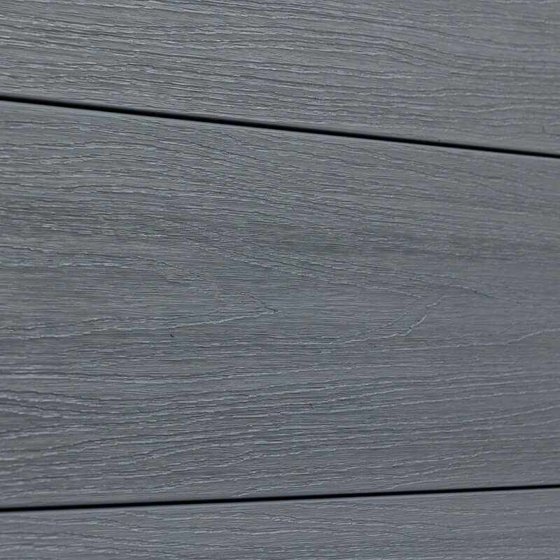 Silver gray co-extruded composite fence board close-up showing realistic wood grain texture and horizontal plank design