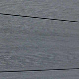 Gray wood grain composite fence board close up, textured weather resistant composite fencing material