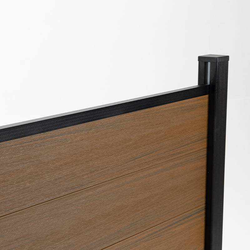 Wood look composite fence panel top rail with black aluminum post, co-extruded composite outdoor fencing detail