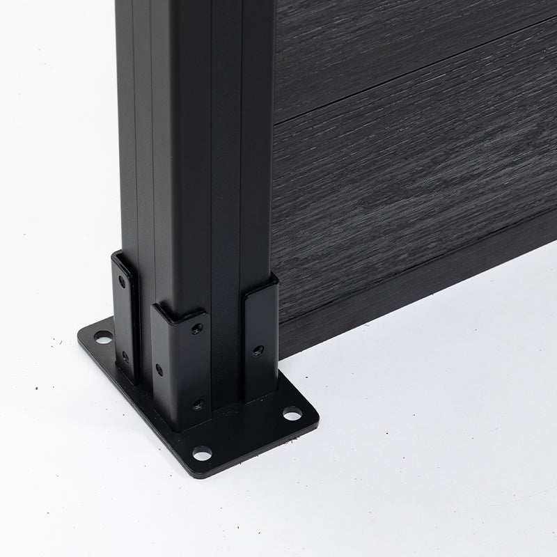 Close-up of black aluminum fence post base with dark composite fence panel installed