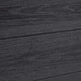 Close-up of dark charcoal composite fence boards with realistic wood grain texture