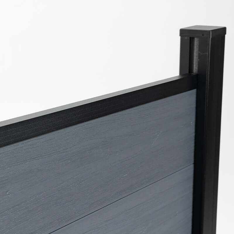 Gray composite fence panel top rail with black aluminum post, modern outdoor privacy fencing detail