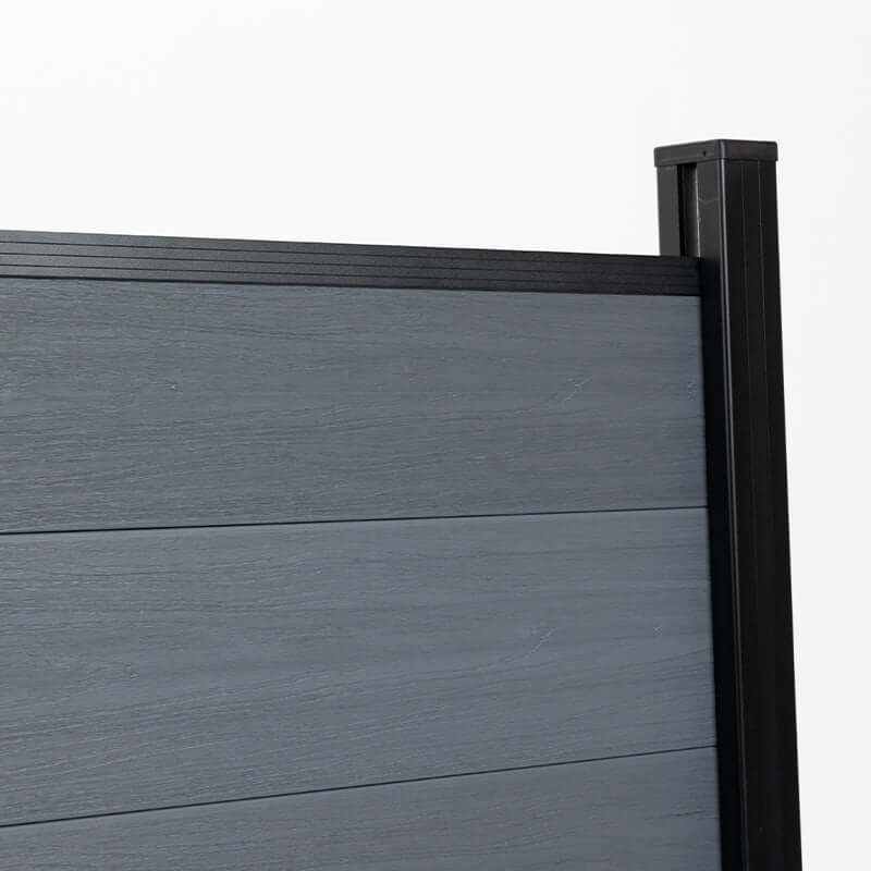 Gray composite fence panel with black aluminum post, close up of modern outdoor privacy fencing system