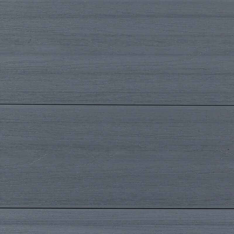 Gray composite fence boards with natural wood grain finish, close up view of outdoor composite fencing panels