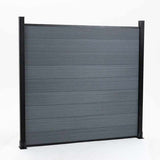 Gray composite privacy fence panel with black aluminum posts, modern outdoor fencing system, low maintenance composite boards