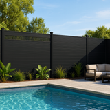 Black composite privacy fence with ventilation panel installed around backyard pool